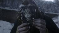 In Frankenstein 2025, Jacob Elordi’s Creature examines a war photo that mirrors his own likeness, emphasizing the film’s themes of identity and suffering. (Image via Netflix)